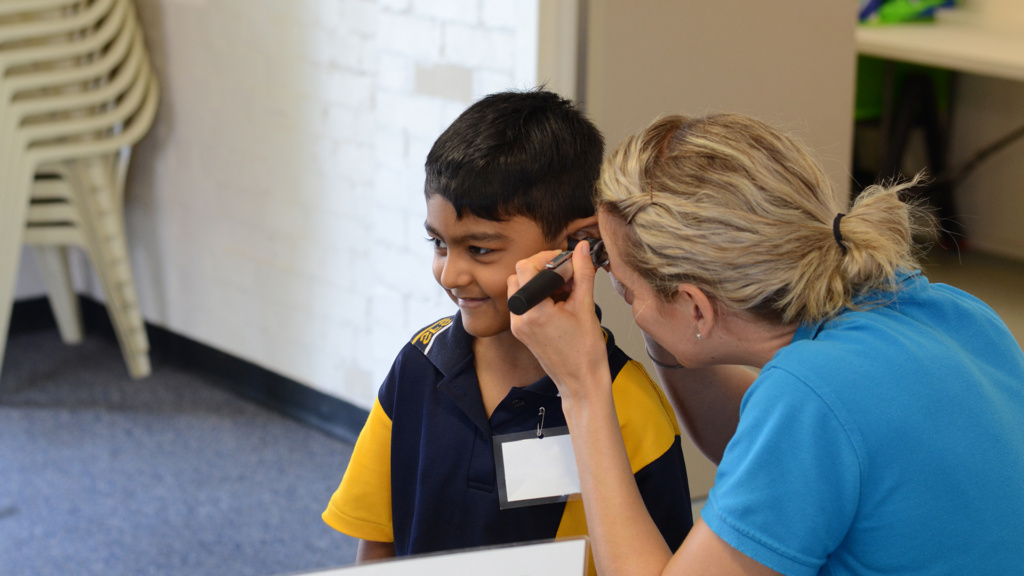 Child Having Examination Of Ear Flipped