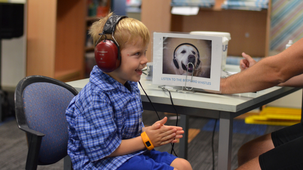 Child Wearing Headphones For Hearing Test