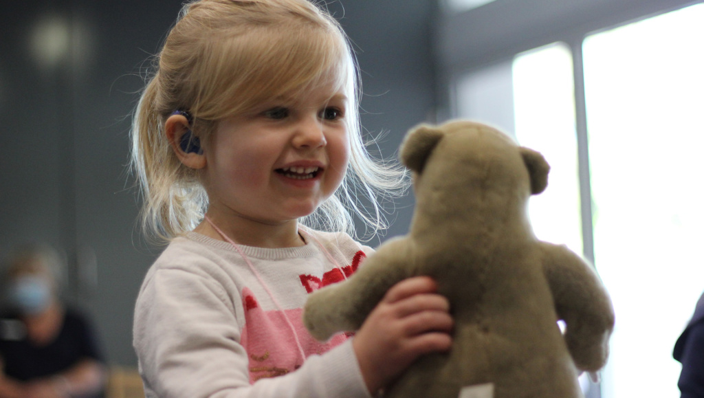Img Child Wearing Hearing Aids With Toy Bear