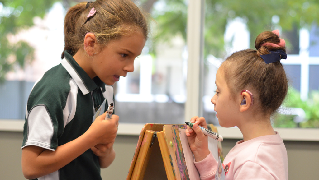 Children Drawing On Easel