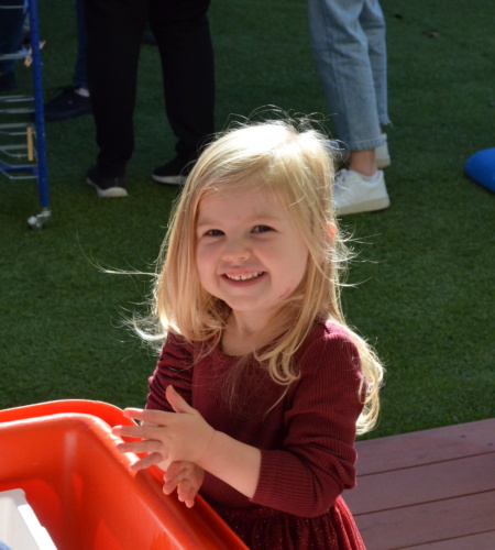 Girl at playgroup smiling