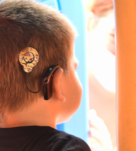Boy Wearing Cochlear Implant